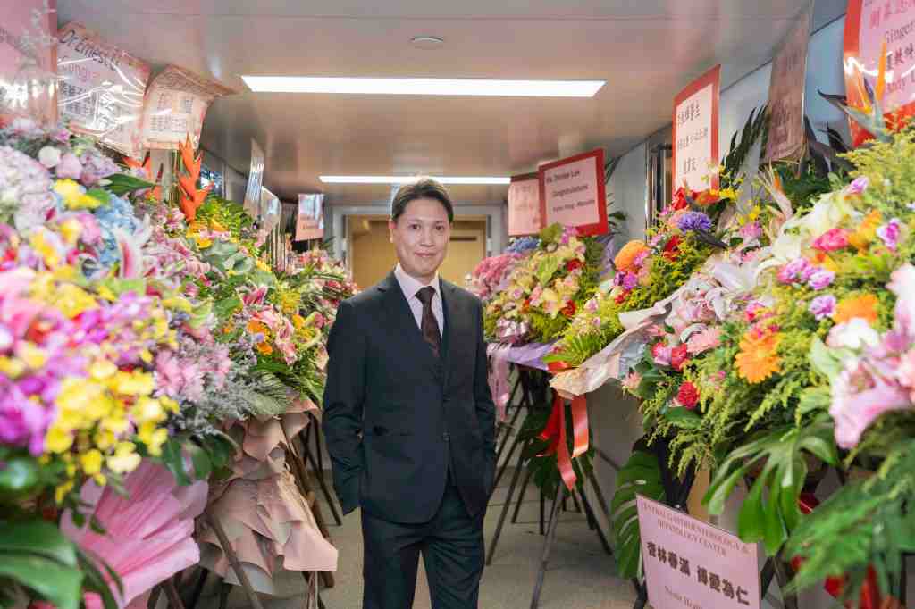 Dr. Ernest Li and flowers
